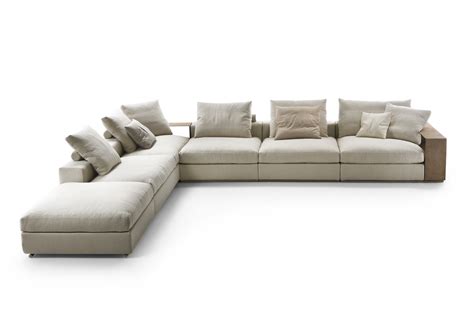 Groundpiece sectional sofa  The low, deep sofa, with its signature goose-down cushions and padded armrests that
